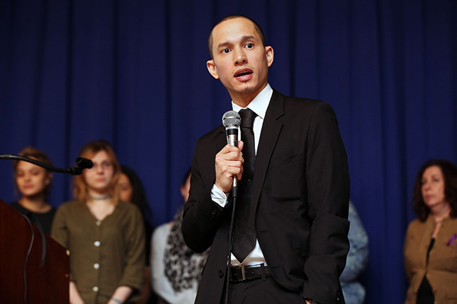 Khalil speaking in front of an audience.